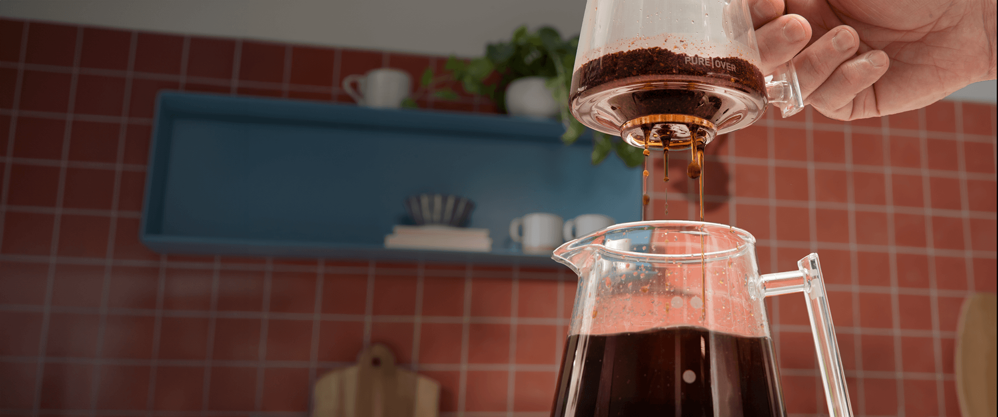 Pure Over all-glass pour over coffee maker brewing coffee with Signature Brew Kit designed for clean, filterless brewing